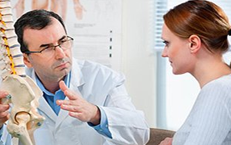 A woman talking to a doctor