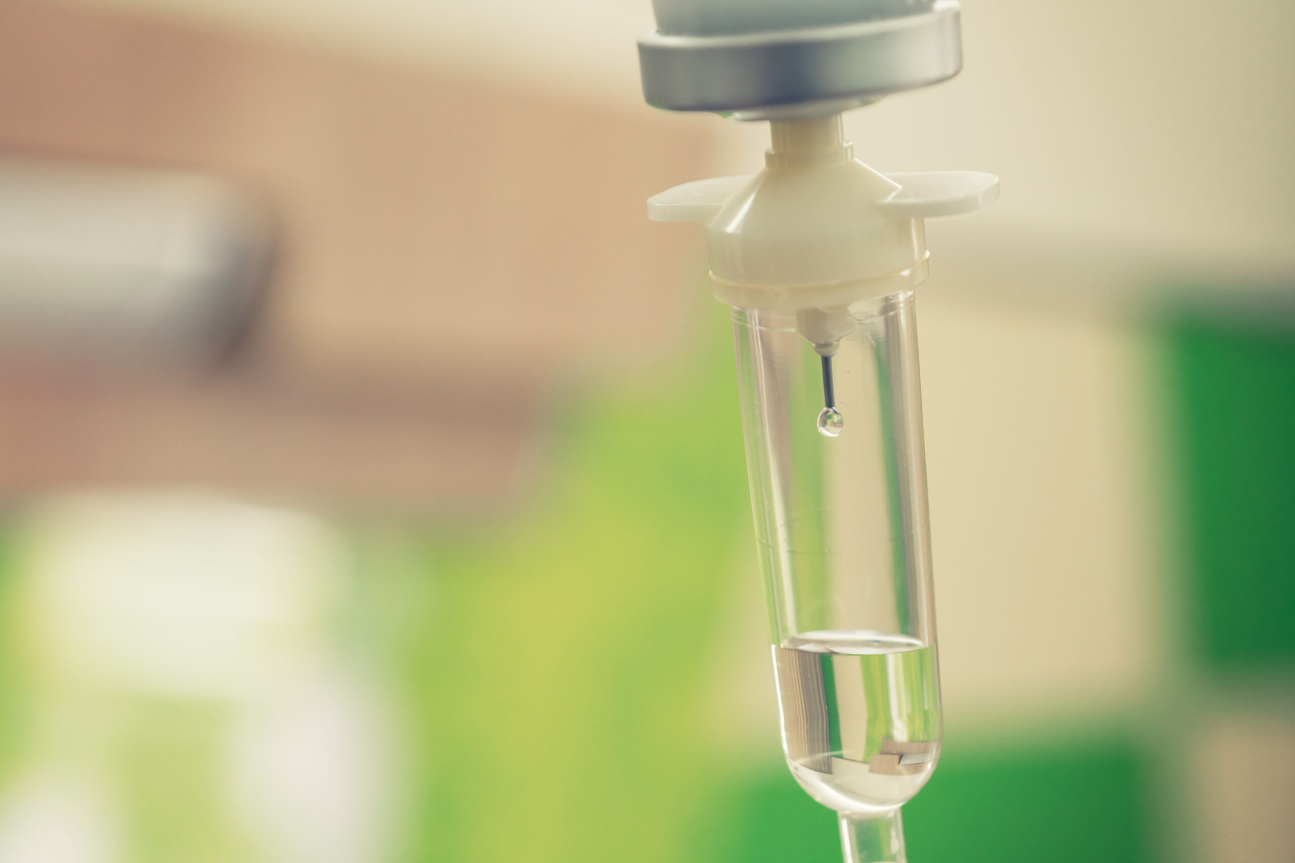 Closeup of an IV drip with a drop.